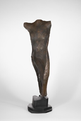 A copper sculpture of a nude female figure with no head, arms, or feet.