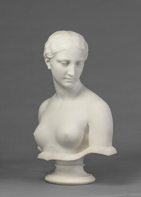 A marble bust of a bare-breasted woman.