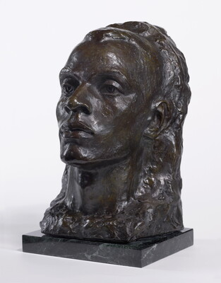 A bronze bust of a Black man emerging from a heavily textured background.