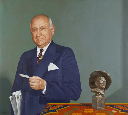 An oil painting of an older White man holding newspapers under his arm and standing next to a table on which sits a Remington sculpture.
