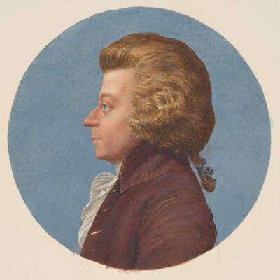 A circular watercolor portrait of a White man in profile with a thick blond wig and pigtail, wearing an 18th century coat and ruffled white shirt.