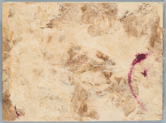 Handmade paper in neutral colors with a pink brushstroke on the right side of the paper.