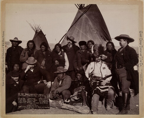 A black-and-white photograph of Indigenous men and U.S. officials in front of tipis.