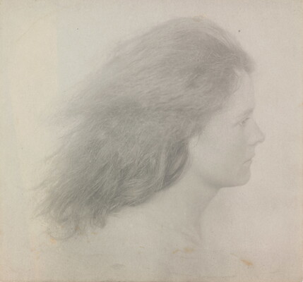 A black-and-white photograph of a young White woman in profile from the neck up with her shoulder-length hair streaming behind her.