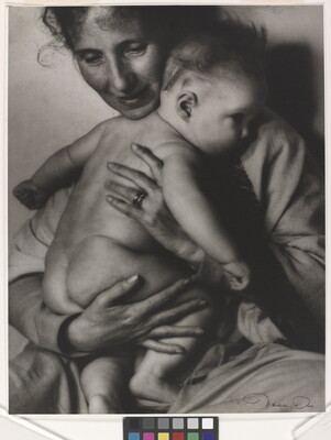 A black-and-white photograph of a White woman holding a naked baby to her chest.