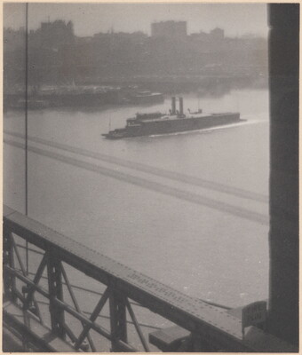 A black-and-white photograph of a boat preparing to cross under a bridge as viewed from the bridge.