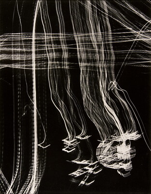 An abstract black-and-white photograph of streaks of white light intersecting at right angles across the page creating a plaid pattern.