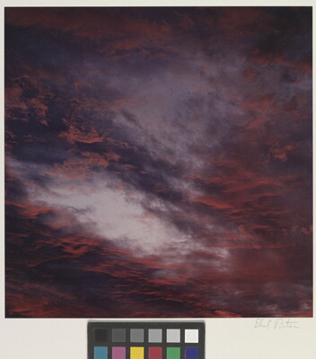 A color photograph of blue, pink, and orange clouds at sunset.