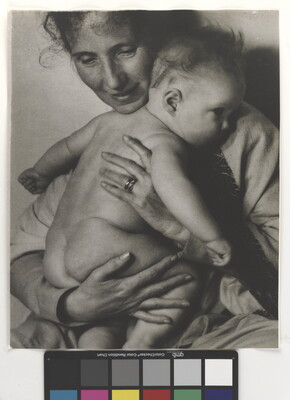 A black-and-white photograph of a White woman holding a naked baby to her chest.
