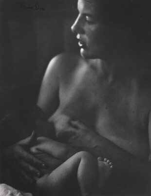 A black-and-white photograph of a White woman nursing a naked infant.