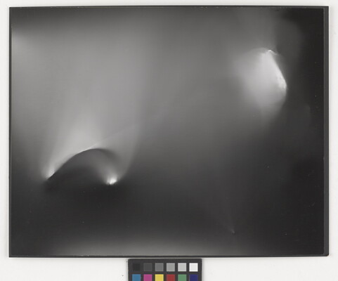 An abstract black-and-white photograph of foggy arcs of light against a black background.