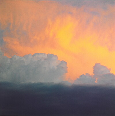 A color photograph of clouds: dark at the bottom, billowing white clouds in the middle, and soft gold and orange clouds at the top.