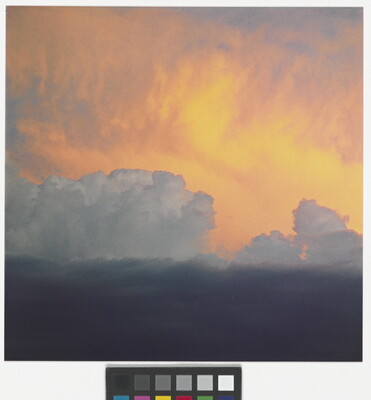 A color photograph of clouds: dark at the bottom, billowing white clouds in the middle, and soft gold and orange clouds at the top.