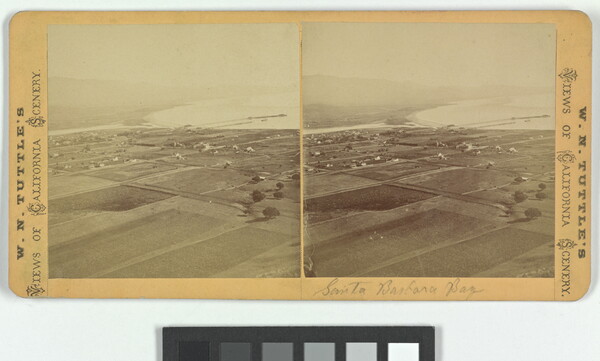 Two almost identical sepia-toned photographs side by side of flat land dotted with buildings next to a body of water.