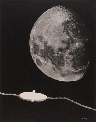 A black-and-white photograph of the moon above an electric cord with a switch.
