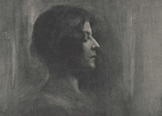 A black -and-white portrait photograph of a young White woman in profile, eyes closed.