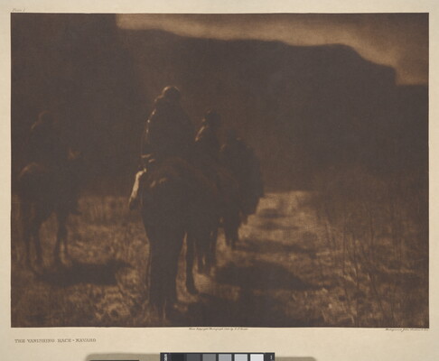 A dark, sepia-toned photograph of people on horseback riding away from the viewer.