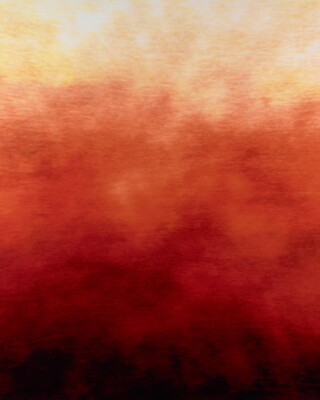 An abstract color photograph of yellow changing to dark red and black from the top down.