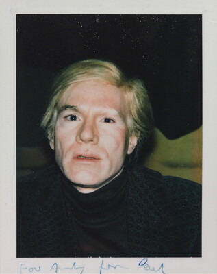 A color snapshot photograph of a White man with blond hair wearing a dark turtleneck.