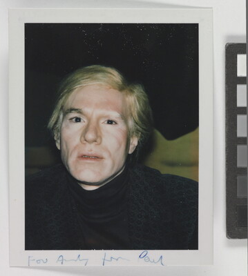 A color snapshot photograph of a White man with blond hair wearing a dark turtleneck.