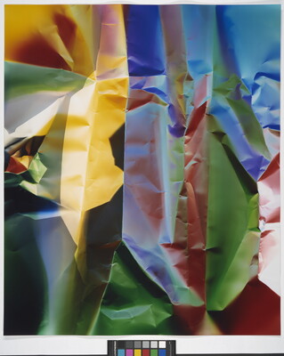 A color photograph of what looks like crinkled paper in yellow, blue, green, and red.
