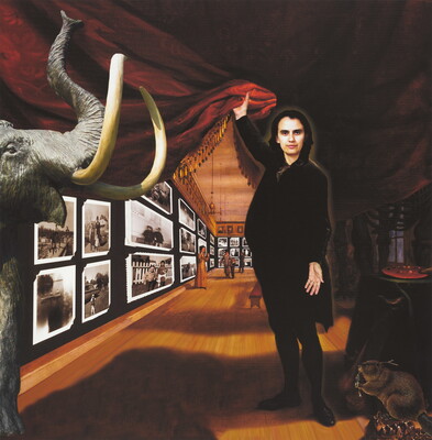 A color photo-collage of an Indigenous person holding up a red curtain allowing viewers to see black-and-white snapshots displayed on a gallery wall salon-style.