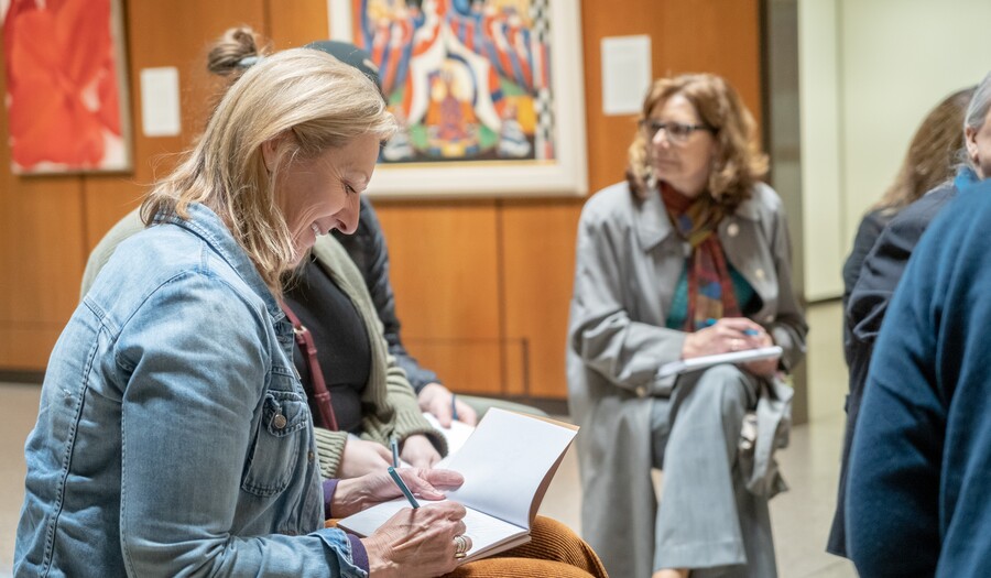 Seated visitors take notes in a Carter gallery. 