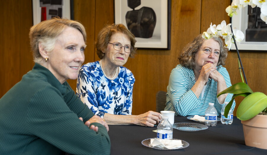 Three older White women sit at a table in the Carter's Lounge enjoying tea and each other's company.