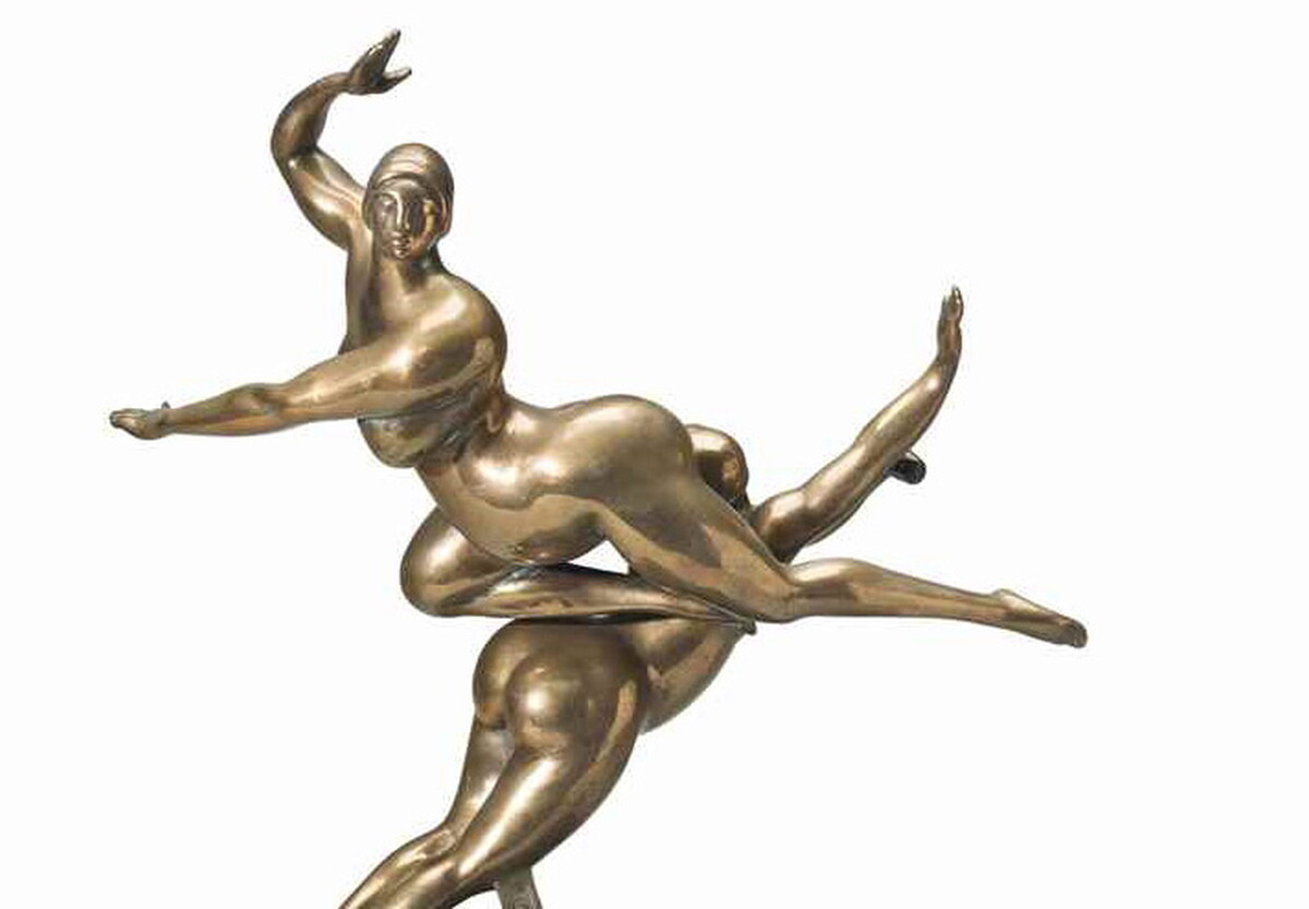 A bronze sculpture of two nude women leaping with arms and legs out in different directions.