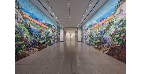 Mural made out of colored pinata paper in a hallway