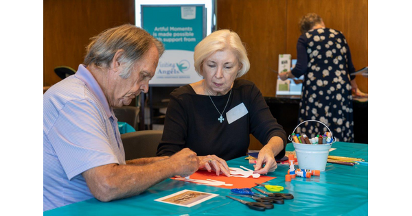 Senior adults work on an art project at the Carter.