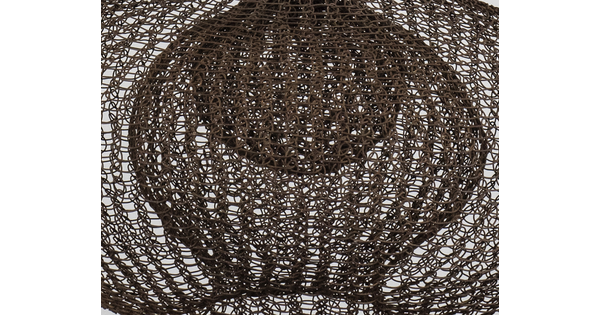 A detail of a hanging sculpture made of woven wire thread that creates three orb like shapes with smaller orbs nested inside each.