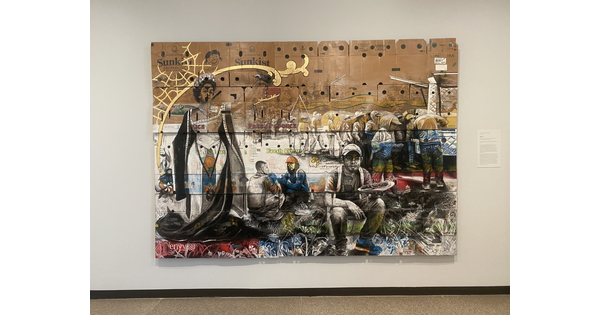 Narsiso Martinez&#039;s &quot;Royal-ty&quot; painted on cardboard produce boxes hangs at the Carter.