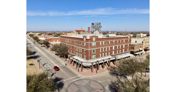 A large, four-story, red-brick building, the Grace Museum, at the intersection of two streets.