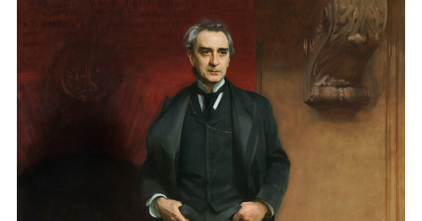 A life-size oil painting of an middle-aged White man in a dark, three-piece suit and tie with his thumbs in his front pockets, standing in front of a large fireplace.