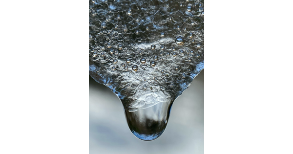 An extreme close-up of melting snow.