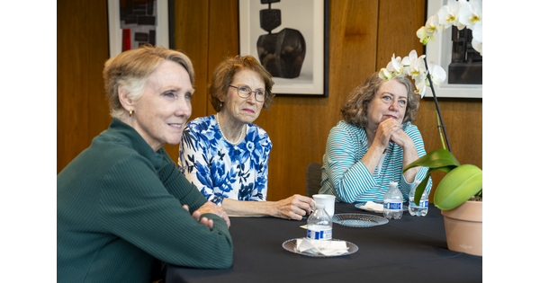 Three older White women sit at a table in the Carter's Lounge enjoying tea and each other's company.