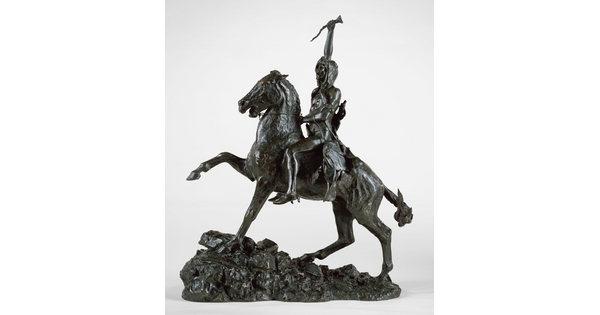 A bronze sculpture of a man on horseback holding a piece of scalp and hair in his hand thrusted above his head triumphantly.