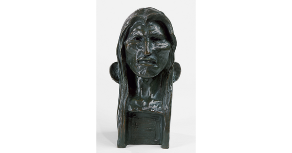 A bronze bust of an Indigenous man with long hair.