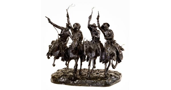 A bronze sculpture of four cowboys riding horses while holding their guns high in the air.