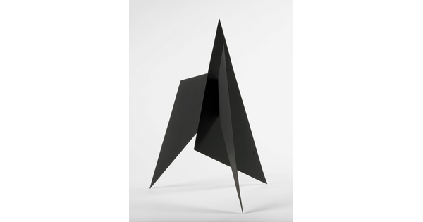 A black abstract tabletop sculpture with sharp points.