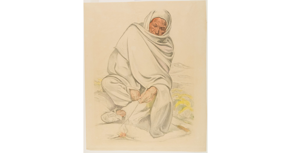 A color print of a seated Indigenous person wrapped in a blanket poking a fire with a stick.