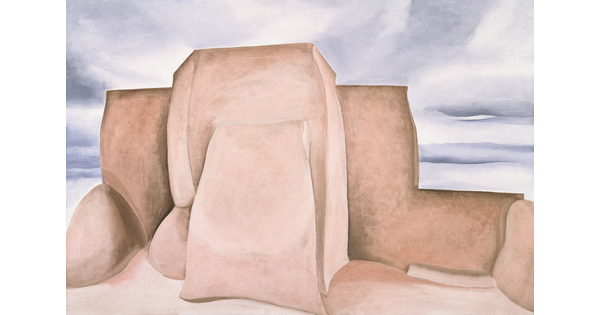 An oil painting of the back of a large adobe structure set against a muted blue sky.