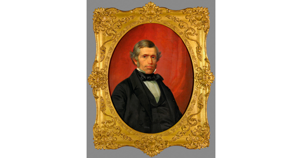 A portrait oil painting in a gold frame of a well-dressed White man with gray hair and sideburns.