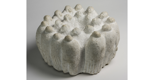 A marble sculpture of figures, all facing inward, in two concentric circles.