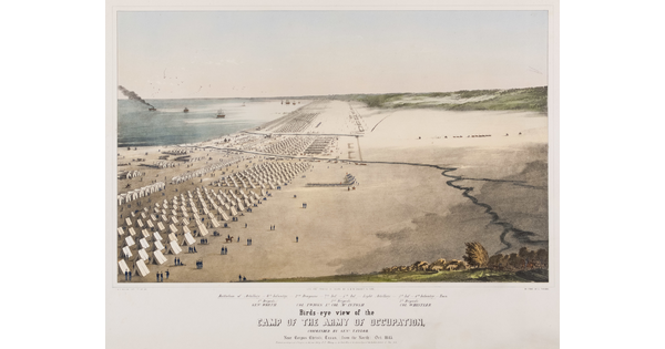 A color print of a military camp, consisting of many rows of white A-frame tents, on a beach with a body of water in the background.