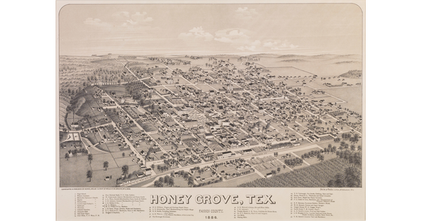A black-and-white print of a bird's eye view of a town showing its grid of streets and a railroad in the foreground.