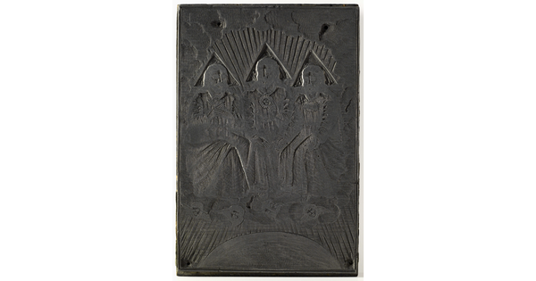 An engraved metal printing plate of three seated male figures draped in robes seated on thrones on a cloud.