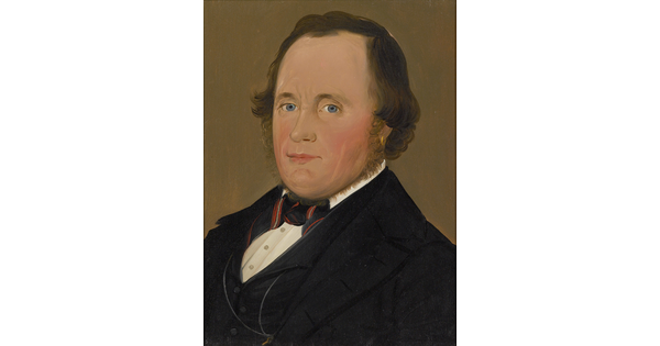 An oil painting of the head and shoulders of a middle aged White man with bright blue eyes and a pink face, wearing a suit.