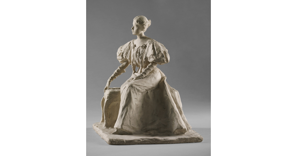 A white, plaster sculpture of a young woman sitting on a bench in a long dress with puffy sleeves.
